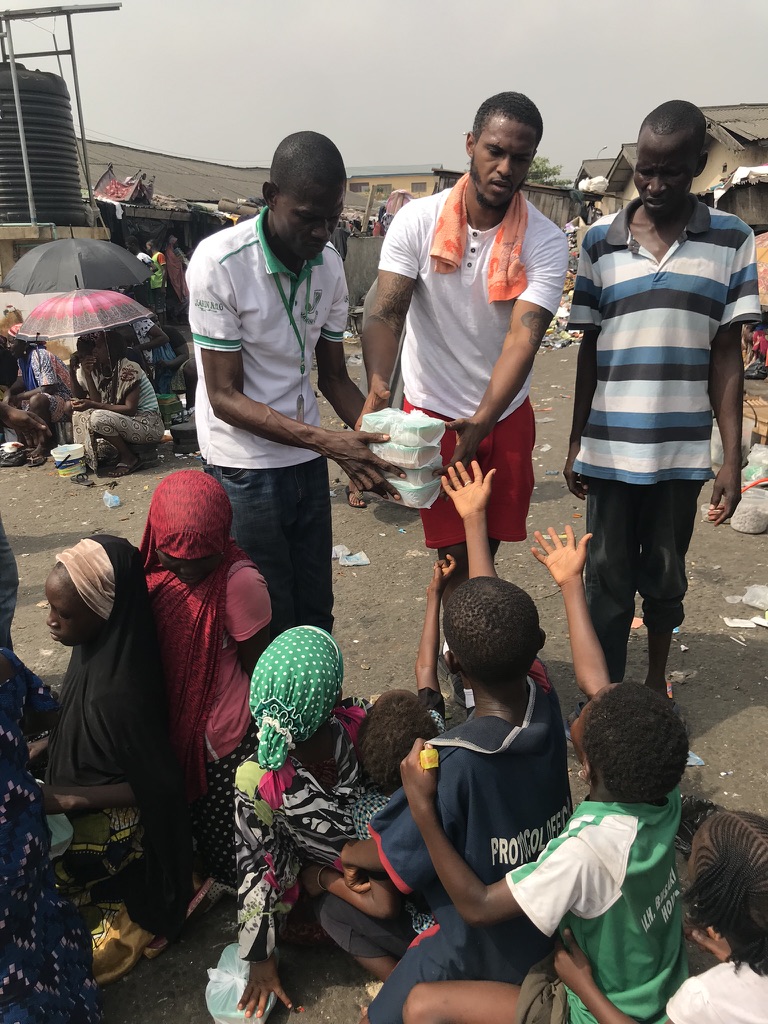 Children reaching up for food